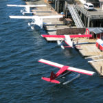 A sea plane pulling up to a dock in Ketchikan