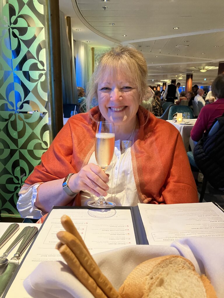 Cindi with a Prosecco before Dinner